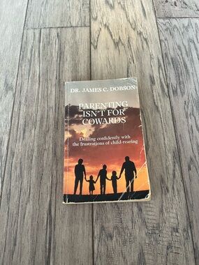 Parenting Isn't for Cowards by Dr. James C. Dobson - Orange Sunset Cover